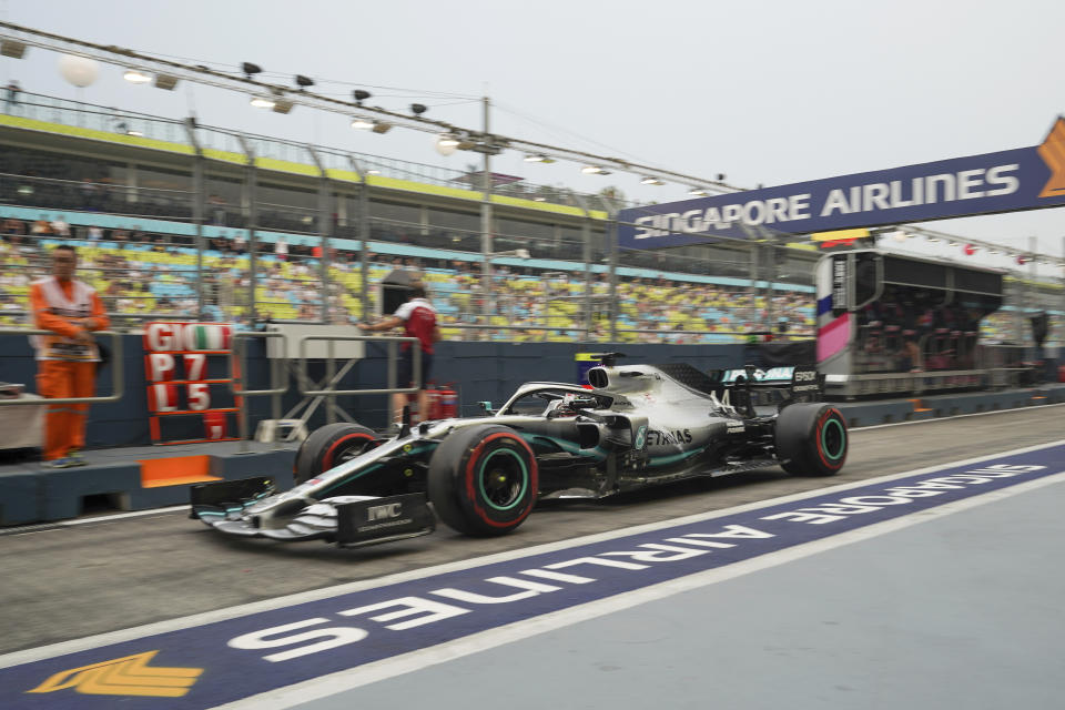 Mercedes driver Lewis Hamilton of Britain steers his car during the first practice session at the Marina Bay City Circuit ahead of the Singapore Formula One Grand Prix in Singapore, Friday, Sept. 20, 2019. (AP Photo/Vincent Thian)