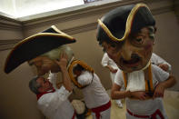 <p>Members of the San Fermin Comparsa Parade get ready to take part in a procession at the San Fermin Festival, in Pamplona, northern Spain, July 7, 2018. (Photo: Alvaro Barrientos/AP) </p>