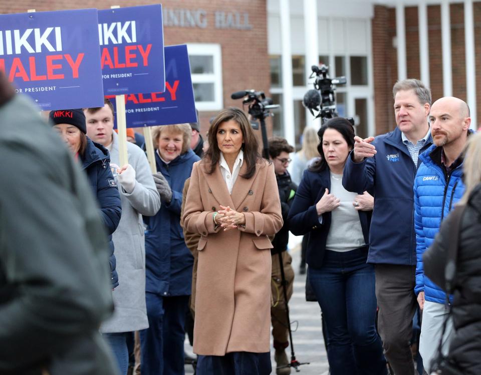 Republican presidential candidate Nikki Haley and New Hampshire Gov. Chris Sununu stop by the primary polls in Hampton Tuesday, Jan. 23, 2024.