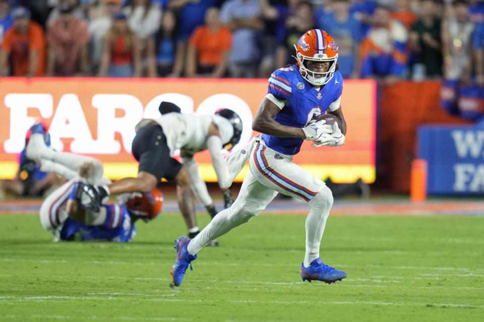 Florida wide receiver Elijhah Badger (6) runs for yardage against Central Florida during the first half of an NCAA college football game, Saturday, Oct. 5, 2024, in Gainesville, Fla. (AP Photo/John Raoux)