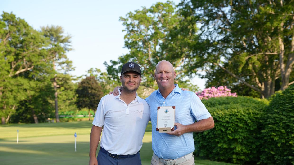 Brendan Hester poses with his son Jack, left, after he qualified for last year's U.S. Senior Open. Jack Hester caddied for his father in the round.