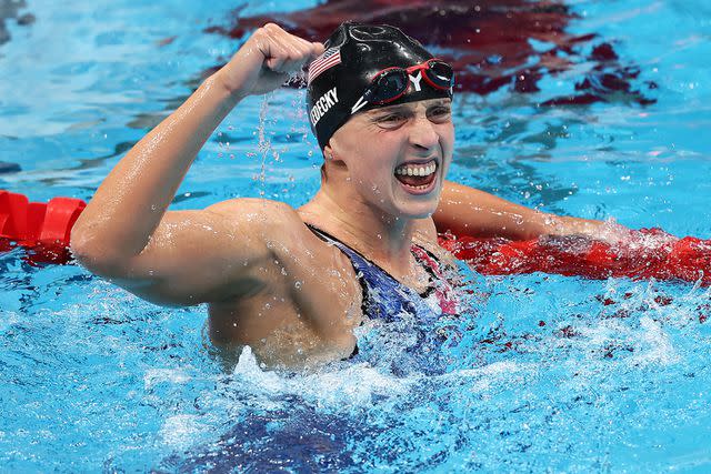 <p>Clive Rose/Getty</p> Katie Ledecky of Team United States celebrates after winning the gold medal in the Women's 1500m Freestyle Final on day five of the Tokyo 2020 Olympic Games at Tokyo Aquatics Centre on July 28, 2021 in Tokyo, Japan.