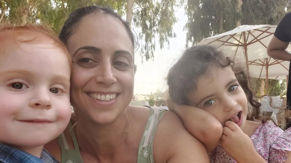 Ofri Bibas Levy with her nephew Ariel (left), now a hostage in Gaza, and her daughter (right). - Ofri Bibas Levy