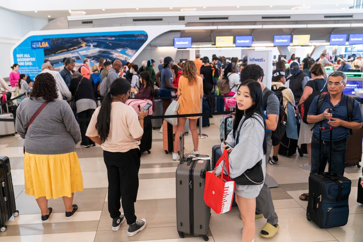 Long lines surround a Southwest ticket counter at LaGuardia Airport  (Copyright 2023 The Associated Press. All rights reserved)