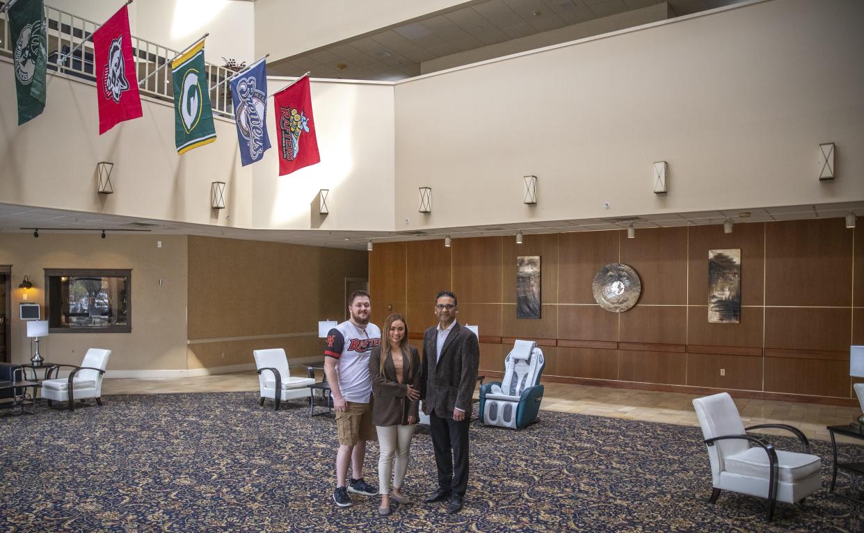 Hotel Mead Resorts & Convention Centers Food and Beverage Manager Adam Serianni, General Manager Lucky Richardson and owner Sean Patel show the hotel's main lobby on Tuesday in Wisconsin Rapids.