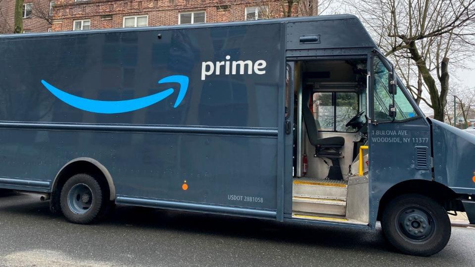 An Amazon Prime delivery van outside residential building in New York City.