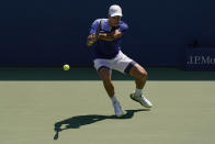 Francisco Cerundolo, of Argentina, returns a shot to Andy Murray, of Great Britain, during the first round of the US Open tennis championships, Monday, Aug. 29, 2022, in New York. (AP Photo/Seth Wenig)