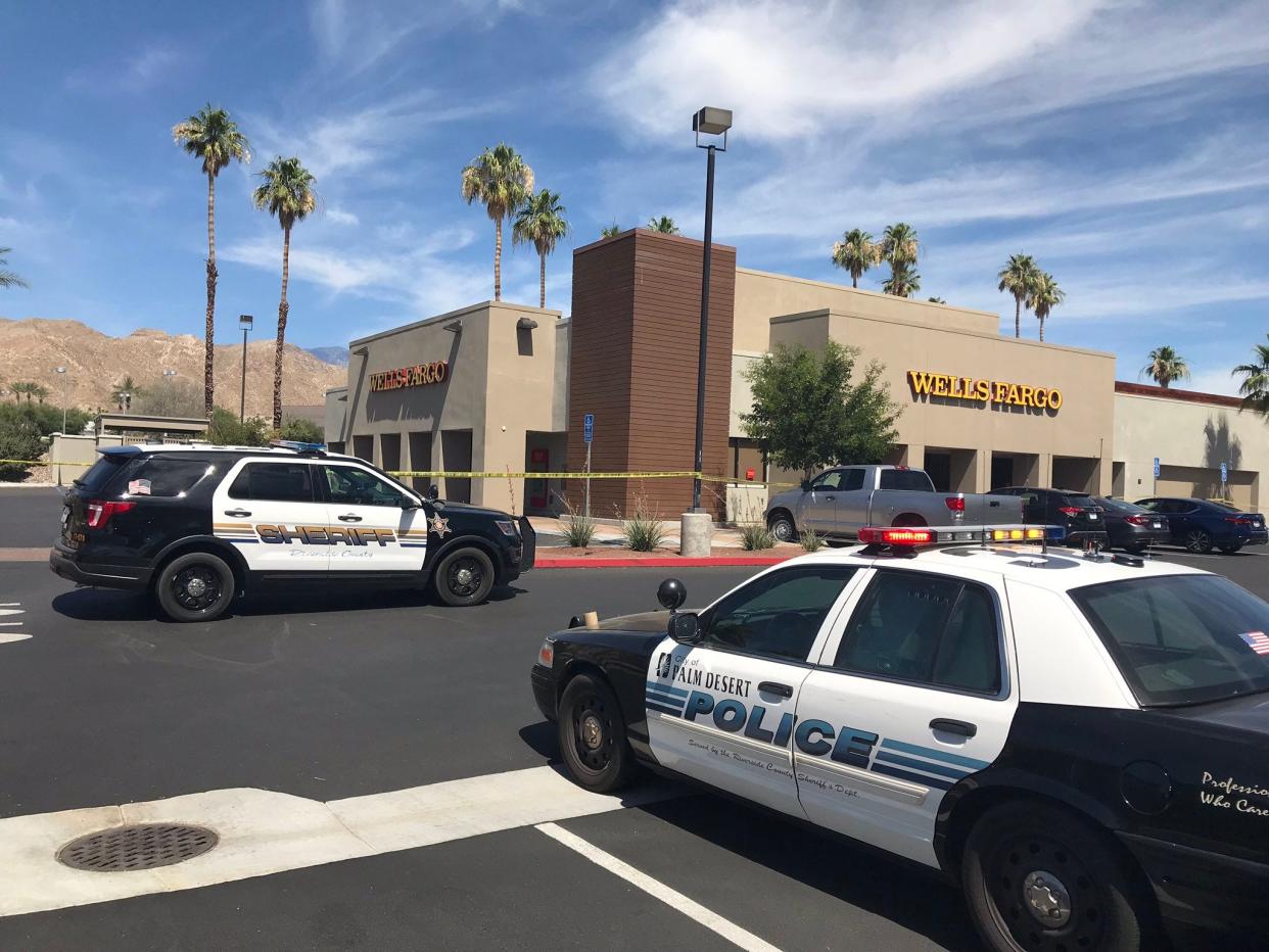 Deputies secure the area of a 2019 robbery at a Wells Fargo Bank branch near The River in Rancho Mirage. Serial robber Todd Cannady has now admitted to that crime and others.