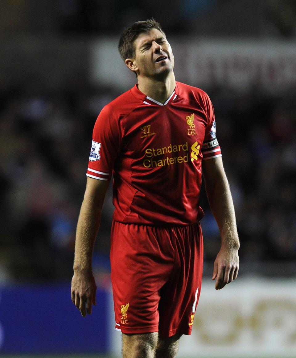 Liverpool's Steven Gerrard reacts after taking a free kick during their English Premier League soccer match against Swansea City at the Liberty Stadium in Swansea, Wales September 16, 2013.