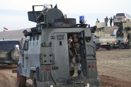 Members of the Kurdish security forces take part in an intensive security deployment after clashes with Islamic State militants in Jalawla, Diyala province November 23, 2014. REUTERS/Stringer