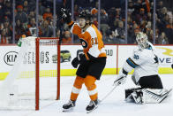 Philadelphia Flyers' Travis Konecny (11) celebrates after scoring a goal against San Jose Sharks' Aaron Dell (30) during the second period of an NHL hockey game, Tuesday, Feb. 25, 2020, in Philadelphia. (AP Photo/Matt Slocum)