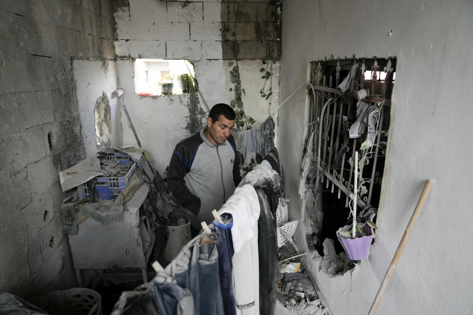 Palestinians inspect a house destroyed by Israeli forces during a military raid in the West Bank town of Tubas, Tuesday, Nov. 28, 2023. (AP Photo/Majdi Mohammed)