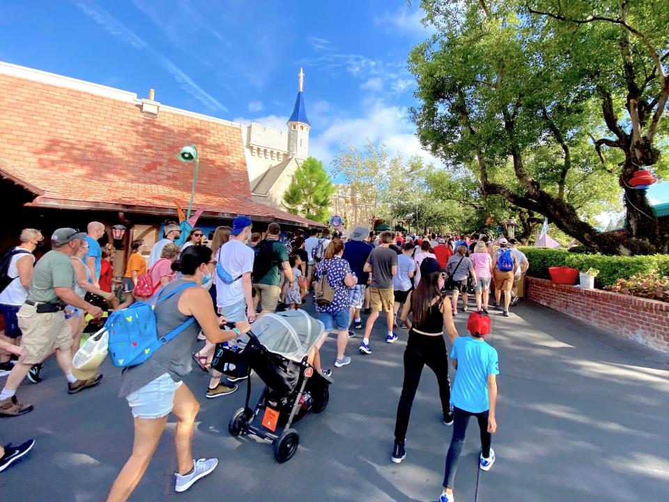 Disney World visitors can be seen rushing to their favorite rides in the morning in August 2021.