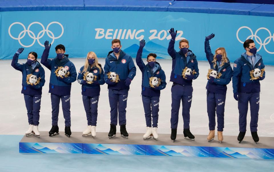 Team USA figure skating team members attend a ceremony at the 2022 Beijing Olympic Winter Games at Capital Indoor Stadium.