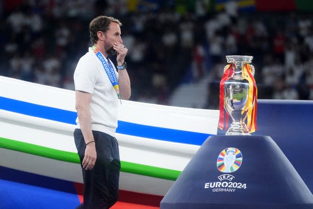 Gareth Southgate walks past the European Championship trophy