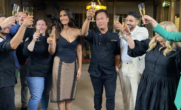 Buddha Lo, host Padma Lakshmi, and fellow cheftestants and judges toast the season following Buddha's historic second victory on Top Chef.<p>Fred Jagueneau/Bravo</p>