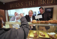 Britain's Prime Minister Boris Johnson visits a bakery during a General Election campaign trail stop in Wells, England, Thursday, Nov. 14, 2019. Britain goes to the polls on Dec. 12. (AP Photo/Frank Augstein, Pool)