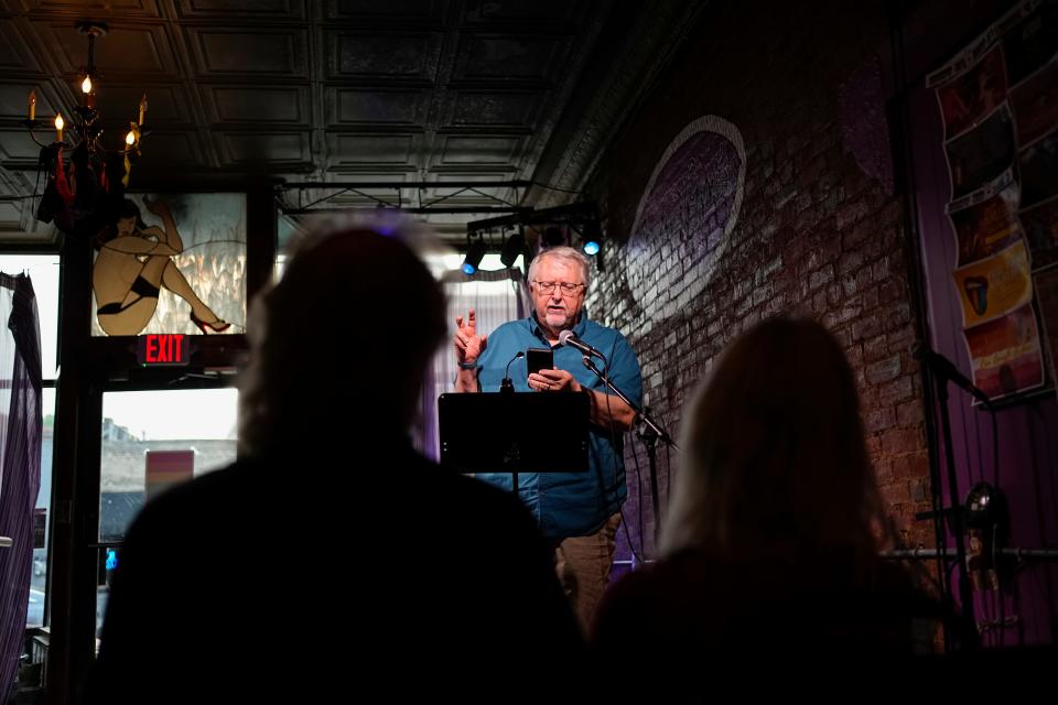 Tom Barlow, of Clintonville, reads during the weekly Poetry Forum, the longest-running poetry open mic in Ohio, at Bossy Grrls Pin-Up Joint in Old North.