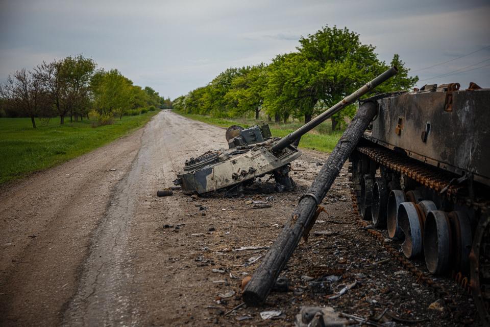 A photograph taken on May 4, 2022 shows a destroyed Russian BMP-3 infantry fighting vehicle on a road near Pokrovske, eastern Ukraine amid the Russian invasion of Ukraine. - The blaze in a football field-length storage building has been burning at least a day but there's no firefighters in Temyrivka because everyone has evacuated, leaving the black smoke to rises unhurriedly.