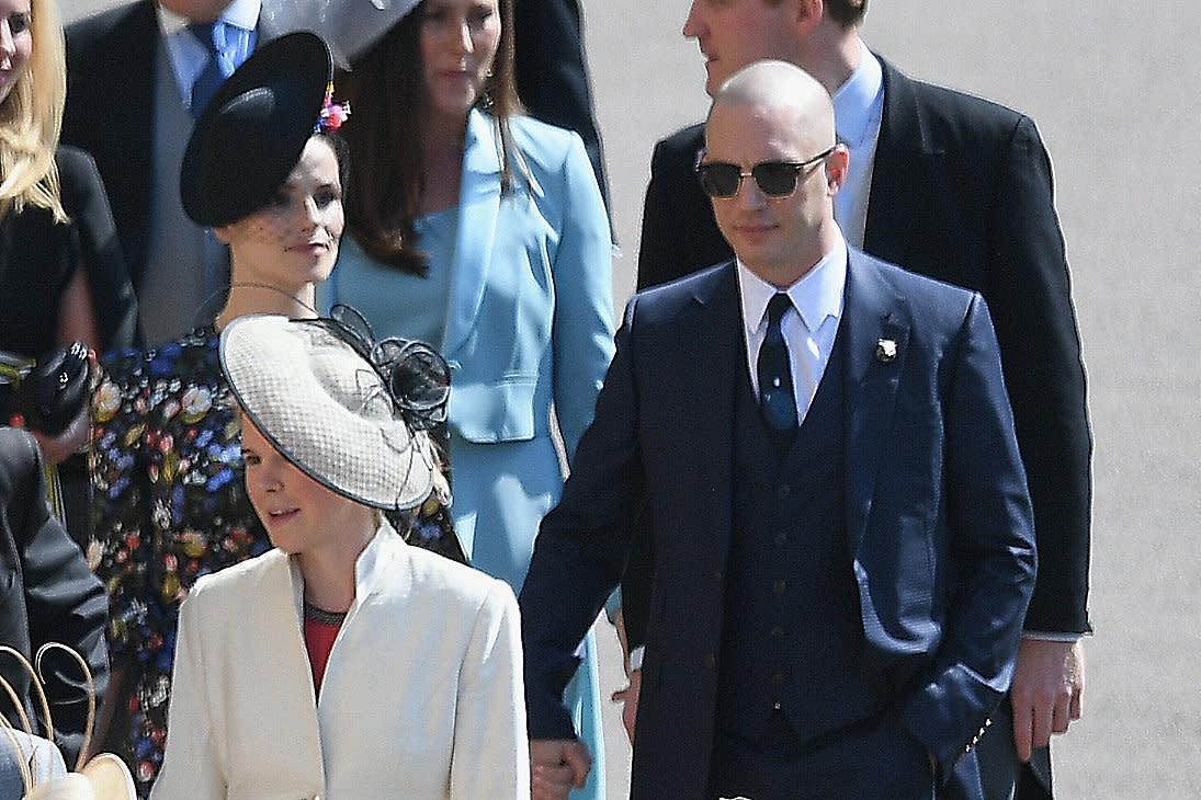 Tom Hardy and his wife attend the wedding of Prince Harry and Meghan Markle on May 19 in Windsor, England. (Photo: Shaun Botterill via Getty Images)