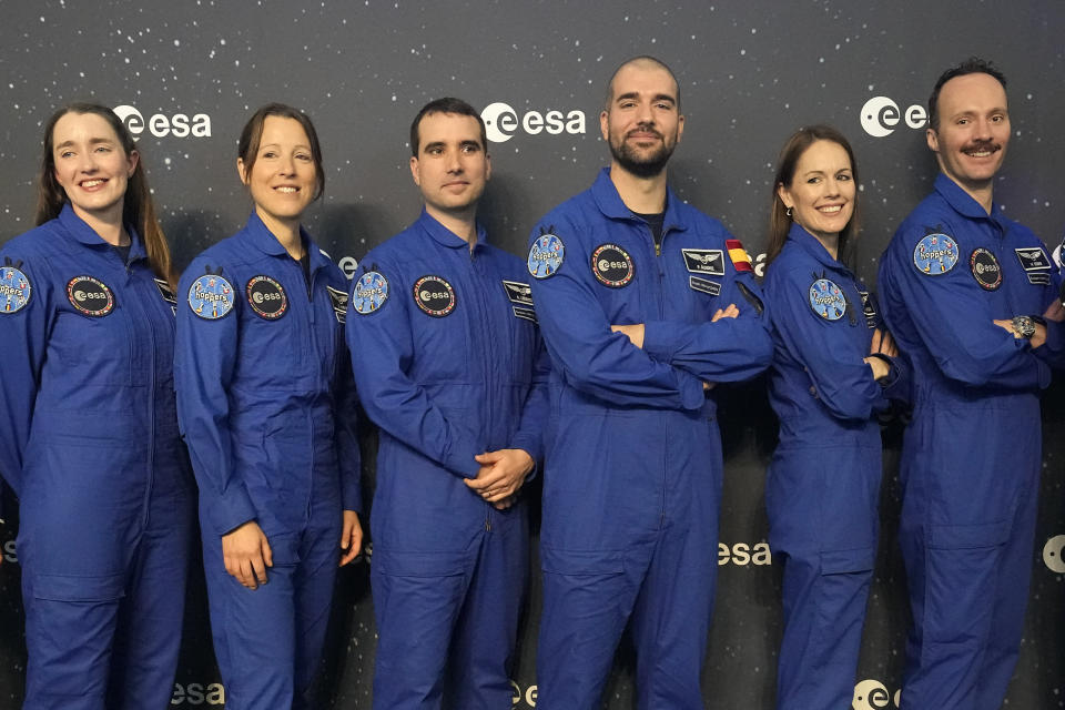 From left, Rosemary Cooga of Britain, Sophie Adenot of France, Raphael Liegeois of Belgium, Pablo Alvarez Fernandez of Spain, Katherine Bennell-Pegg of Australia and Marco Sieber of Switzerland, pose for a family photo at the graduation ceremony of astronaut candidates of the Class of 2022 at the European Astronaut Centre in Cologne, Germany, Monday, April 22, 2024. The new ESA astronauts took up duty at the European Astronaut Centre one year ago to be trained to the highest level of standards as specified by the International Space Station partners. Also concluding a year of astronaut basic training is Australian astronaut candidate Katherine Bennell-Pegg, who has trained alongside ESA's candidates. (AP Photo/Martin Meissner)