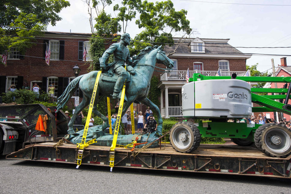 The monument of Stonewall Jackson is hauled away on Saturday, July 10, 2021 in Charlottesville, Va. The removal of the Lee and Jackson statues comes nearly four years after violence erupted at the infamous “Unite the Right” rally. (AP Photo/John C. Clark)