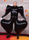 <p> Sam Smith chose fashion over functionality when they wore this inflatable latex jumpsuit to the 2023 Brit Awards. Made by the London-based fashion label Harri, Smith styled the jumpsuit with some matching platform heels, gloves and of course diamond earrings. </p>
