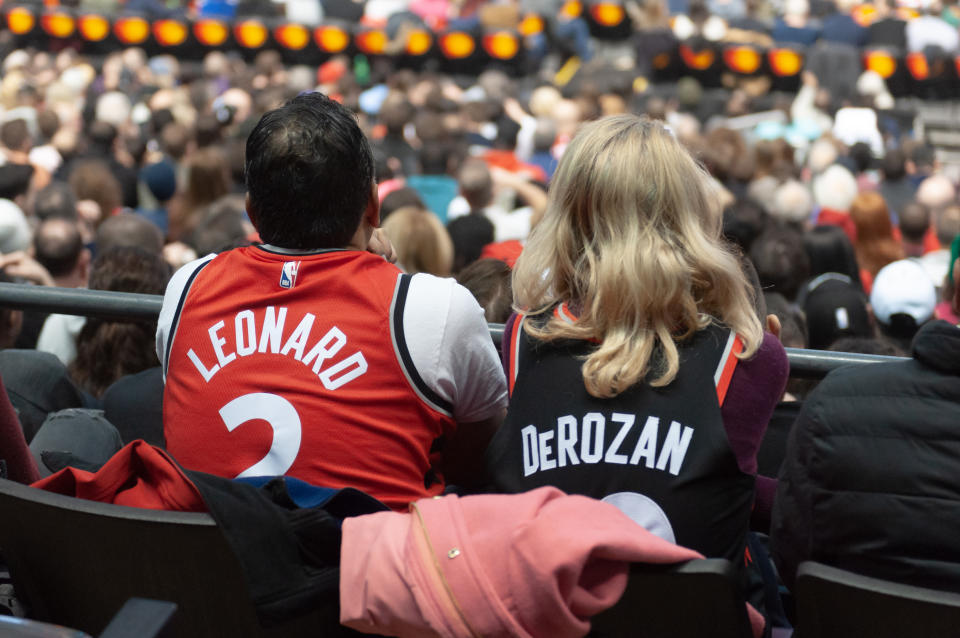 Toronto Raptors fans watch the Toronto Raptors vs San Antonio Spurs NBA regular season game in jerseys of ex-players of Toronto Raprots Kawhi Leonard (L) and DeMar DeRozan (R) at Scotiabank Arena on January 12, 2020 in Toronto, Canada (San Antonio Spurs won 105-104) (Photo by Anatoliy Cherkasov/NurPhoto via Getty Images)