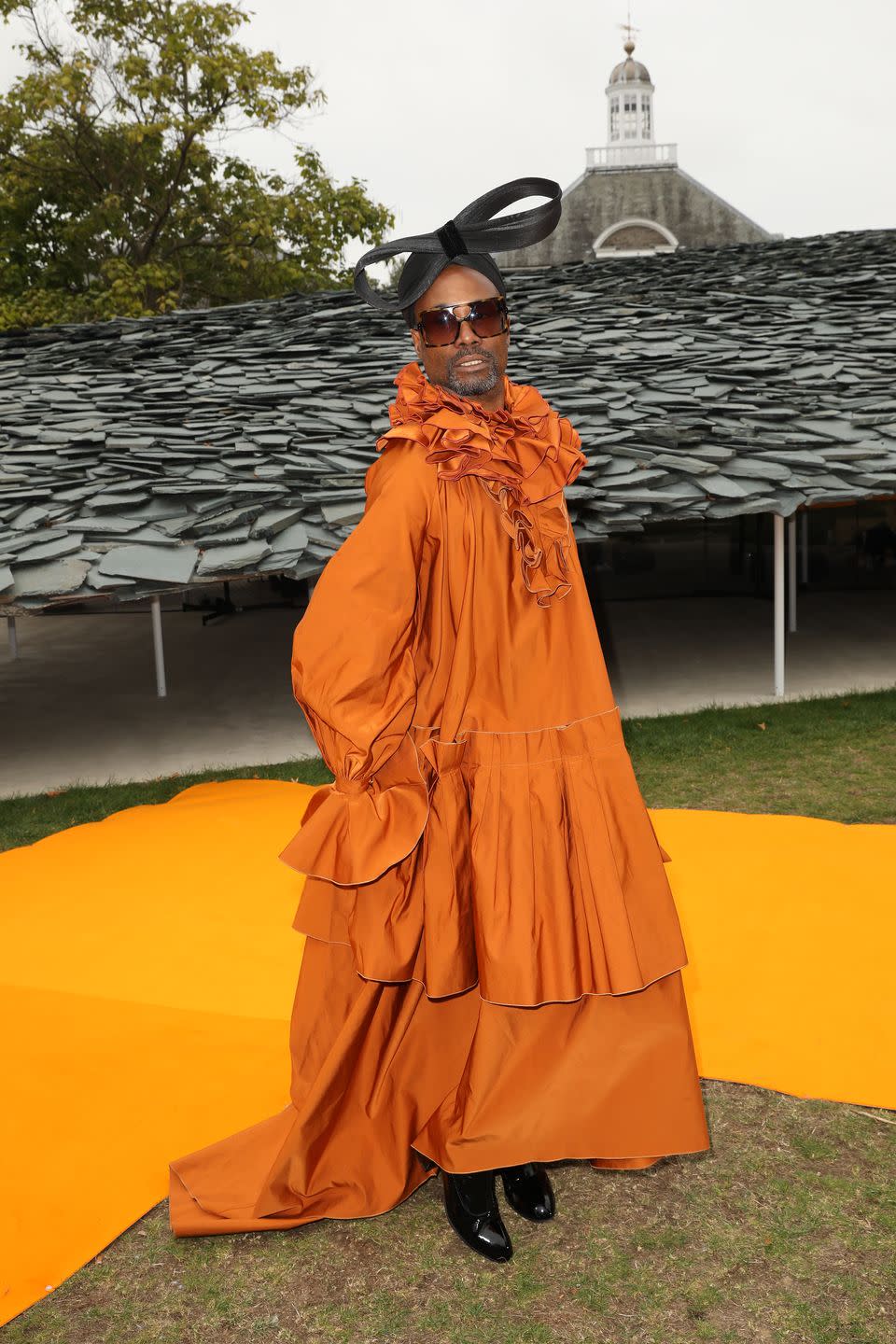 <p>Porter's many looks dominated <a href="https://www.elle.com/uk/fashion/celebrity-style/a29053514/billy-porter-london-fashion-week/" rel="nofollow noopener" target="_blank" data-ylk="slk:London Fashion Week;elm:context_link;itc:0;sec:content-canvas" class="link ">London Fashion Week</a>, during which he made 15 outfit changes in under 72 hours, and had 20 looks in total over the four days. </p><p>To sit FROW at the Roksanda SS20 show, the actor wore a voluminous orange-coloured gown by Roksanda with black boots. He teamed the look with a black bow hat by Sarah Sokol and black shades by The Smith Society. </p><p>Porter later took to <a href="https://www.instagram.com/p/B2kWmhoFjdo/" rel="nofollow noopener" target="_blank" data-ylk="slk:Instagram;elm:context_link;itc:0;sec:content-canvas" class="link ">Instagram</a> to say that he 'immediately started crying' when the runway show began as it was 'simply beautiful'. </p>
