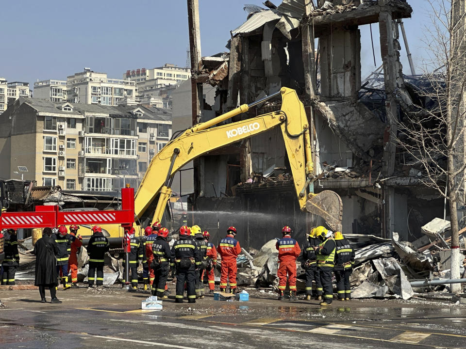 Firefighters work the scene of an explosion in Sanhe city in northern China’s Hebei province on Wednesday, March 13, 2024. Rescuers were responding to a suspected gas leak explosion Wednesday in a building in northern China, authorities said. (AP Photo/Ng Han Guan)