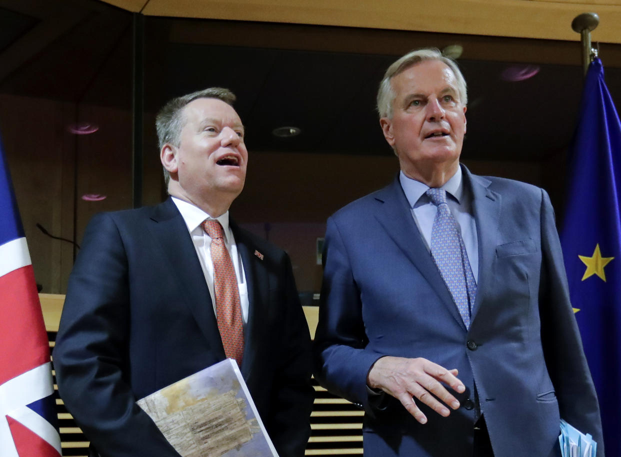 European Union chief Brexit negotiator Michel Barnier (R) and the British Prime Minister's Europe adviser David Frost pose for a photograph at start of the first round of post-Brexit trade deal talks between the EU and the United Kingdom, in Brussels on March 2, 2020. (Photo by Olivier HOSLET / POOL / AFP) (Photo by OLIVIER HOSLET/POOL/AFP via Getty Images)