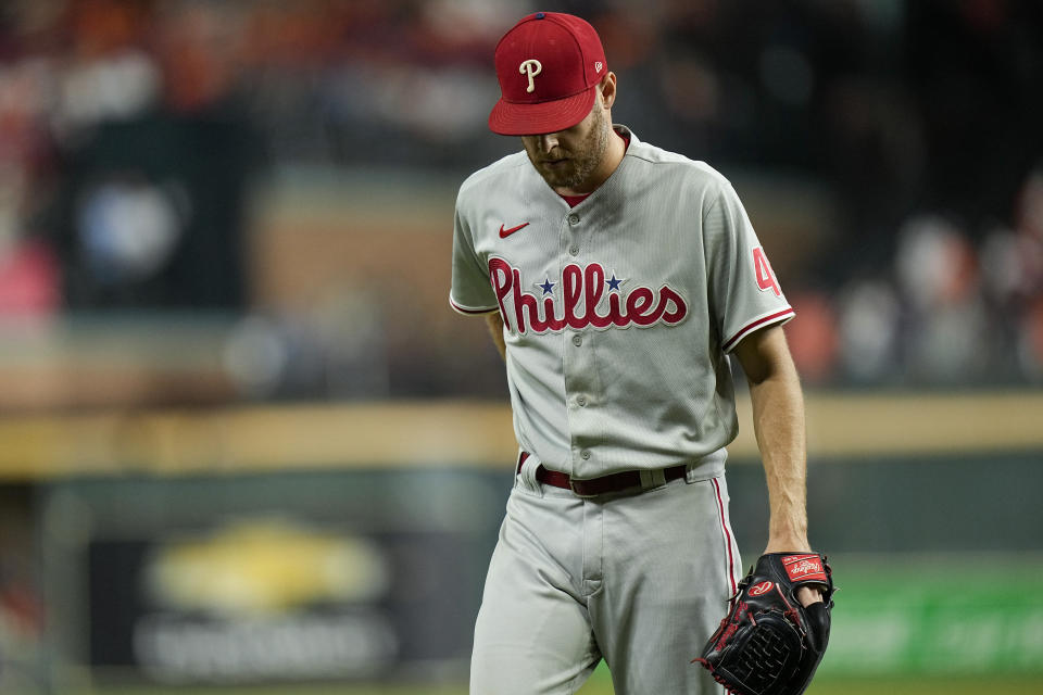 Philadelphia Phillies starting pitcher Zack Wheeler walks back to the dugout after giving up three runs during the first inning in Game 2 of baseball's World Series between the Houston Astros and the Philadelphia Phillies on Saturday, Oct. 29, 2022, in Houston. (AP Photo/Eric Gay)