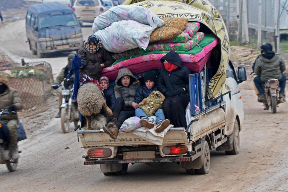 Displaced Syrians flee the countryside of Aleppo and Idlib provinces towards Syria's northwestern Afrin district near the border with Turkey, as regime forces push on with their offensive in the country's northwest.