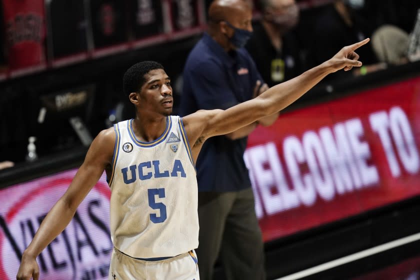 UCLA guard Chris Smith gestures during the first half of an NCAA college basketball game against Pepperdine.