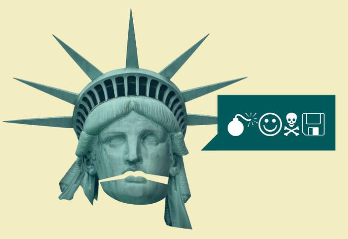 The statue of liberty's head with the mouth open and a speech bubble with symbols for a bomb, a smiley face, skull and crossbones, and a floppy disk