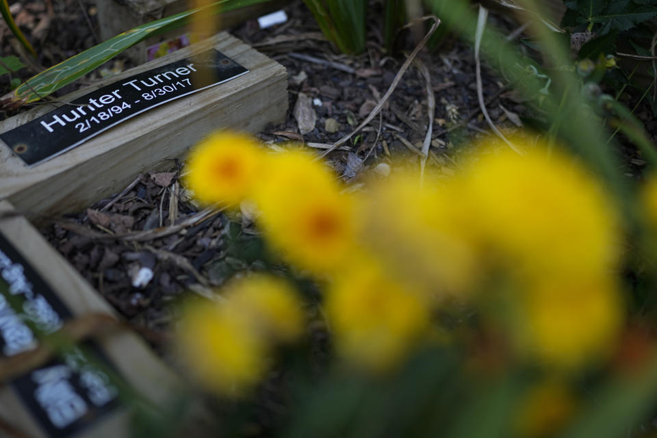 A plaque for Austin Hunter Turner is seen on a roadside memorial for motorcyclists along U.S. Highway 421, also known as The Snake, Friday, Sept. 22, 2023, in Shady Valley, Tenn. Turner, an avid motorcyclist, died after an encounter with the Bristol Police Department in 2017. (AP Photo/George Walker IV)