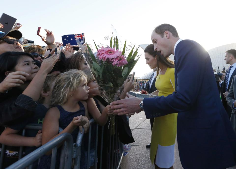 Britain's Prince William and his wife Catherine, Duchess of Cambridge, greet well-wishers following a reception at the Sydney Opera House April 16, 2014. Prince William and his wife are undertaking a 19-day official visit to New Zealand and Australia with their son, Prince George. REUTERS/Jason Reed (AUSTRALIA - Tags: ROYALS)