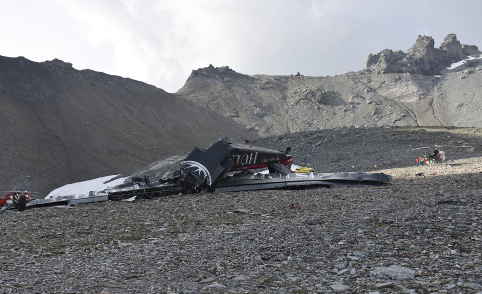 The photo provided by Police Graubuenden shows the wreckage of the old-time propeller plane Ju 52 after it went down went down Saturday Aug, 4 2018 on the Piz Segnas mountain above the Swiss Alpine resort of Flims, striking the mountain's western flank about 2,540 meters (8,330 feet) above sea level. All 20 people on board were killed, police said Sunday, Aug. 5, 2018. (Polizei Graubuenden via AP)