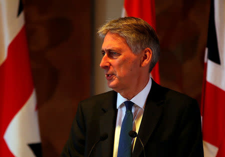 Britain's Chancellor of the Exchequer Philip Hammond speaks during a joint news conference with India's Finance Minister Arun Jaitley in New Delhi, India April 4, 2017. REUTERS/Altaf Hussain