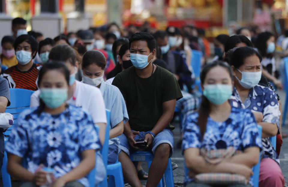 Peoples wait for the the Sinovac COVID-19 vaccination in Bangkok, Thailand, Monday, April 12, 2021. Thailand's Health Ministry warned Sunday that restrictions may need to be tightened to slow the spread of a fresh coronavirus wave, as the country hit a daily record for new cases. (AP Photo/Sakchai Lalit)