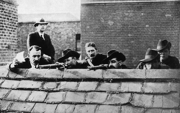 Irish rebels lying in wait on a roof getting ready to fire during the Easter Rising, 1916  - Getty Images