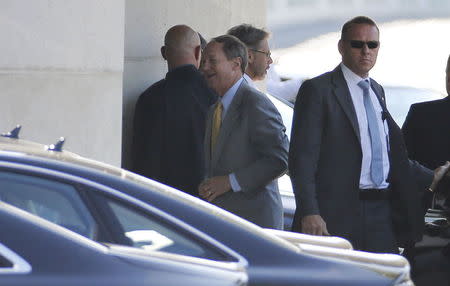 U.S. Ambassador to Germany John Emerson (C) is surrounded by body guards as he arrives at the Chancellery in Berlin, Germany, July 2, 2015. REUTERS/Fabrizio Bensch