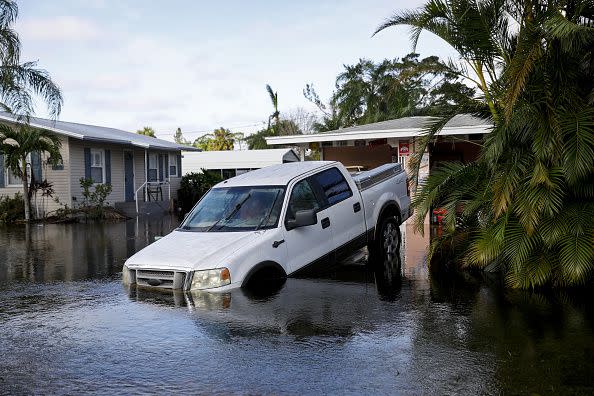 A truck in a flooded driveway following Hurricane Ian in Fort Myers, Florida, US, on Thursday, Sept. 29, 2022. Hurricane Ian, one of the strongest hurricanes to hit the US, weakened to a tropical storm but continues to dump rain on the state as it makes its way up the US Southeast. Photographer: Eva Marie Uzcategui/Bloomberg via Getty Images