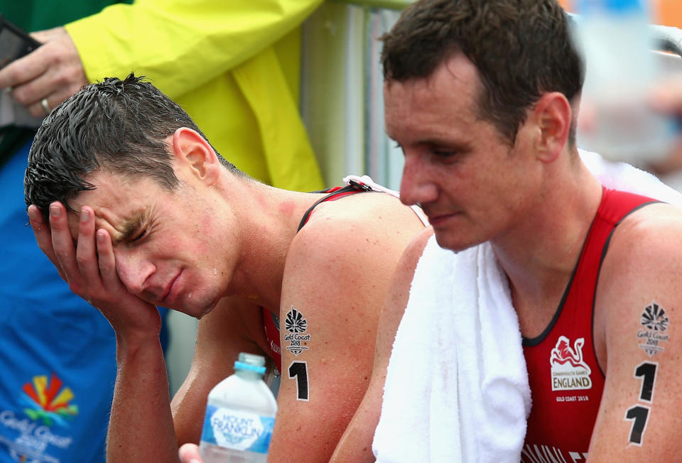 GOLD COAST, AUSTRALIA - APRIL 05:  Jonathan Brownlee of England (1) and Alistair Brownlee of England (11) look dejected after the Men's Triathlon on day one of the Gold Coast 2018 Commonwealth Games at Southport Broadwater Parklands on April 5, 2018 on the Gold Coast, Australia.  (Photo by Michael Dodge/Getty Images)