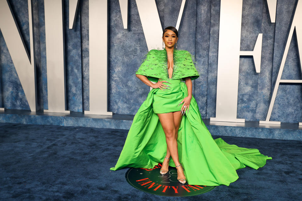 Saweetie wearing lime green dress.