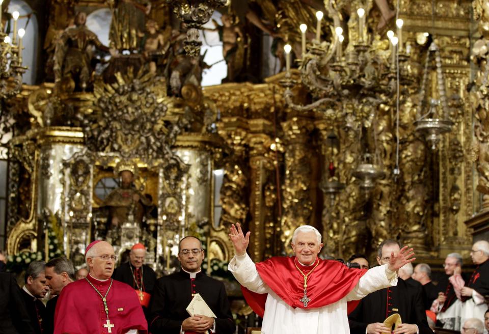 FILE - Pope Benedict XVI waves during his visit to the Cathedral of Santiago de Compostela, northern Spain on Nov. 6, 2010.Pope Emeritus Benedict XVI, the German theologian who will be remembered as the first pope in 600 years to resign, has died, the Vatican announced Saturday. He was 95. (AP Photo/Alessandra Tarantino, File)