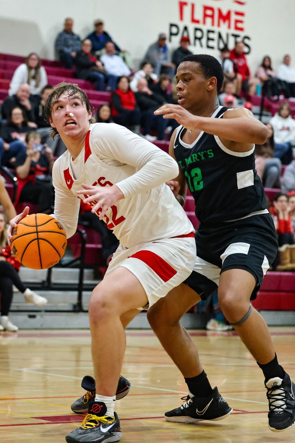 Flames Sean Tetz(22) spins in post and heads for the bucket during a game between St. Mary’s and Lodi at The Inferno in Lodi, CA.