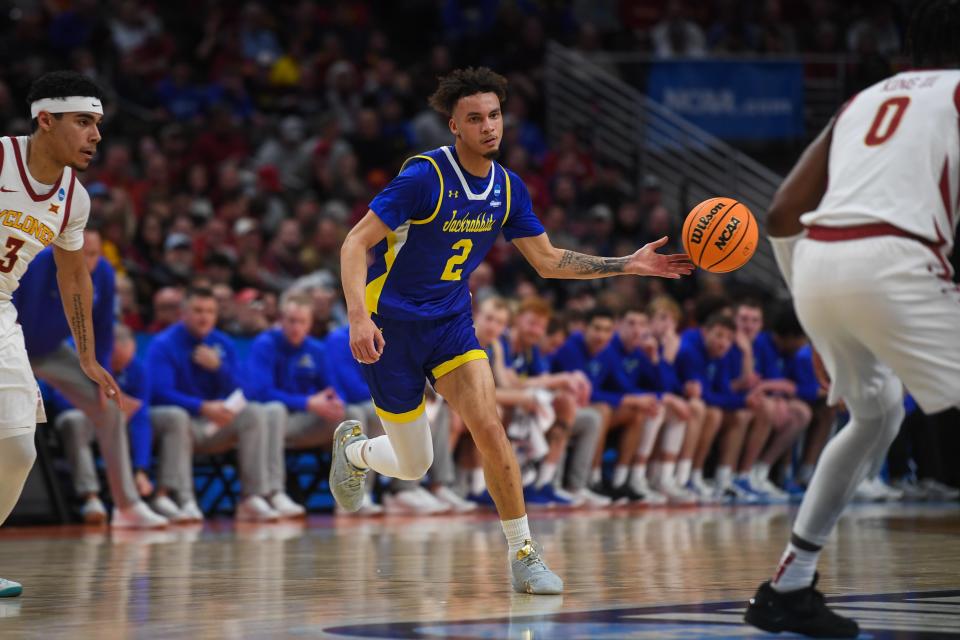 Then with South Dakota State, Zeke Mayo (2) passes the ball to a teammate during the first half of a game on March 21, 2024 at the CHI Health Center in Omaha, Nebraska.