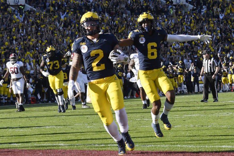 Michigan Wolverines running back Blake Corum (L) scores on a pass from quarterback J.J. McCarthy in the first quarter against the Alabama Crimson Tide in the 2024 Rose Bowl Game on Monday at the Rose Bowl in Pasadena, Calif. Photo by Jon SooHoo/UPI