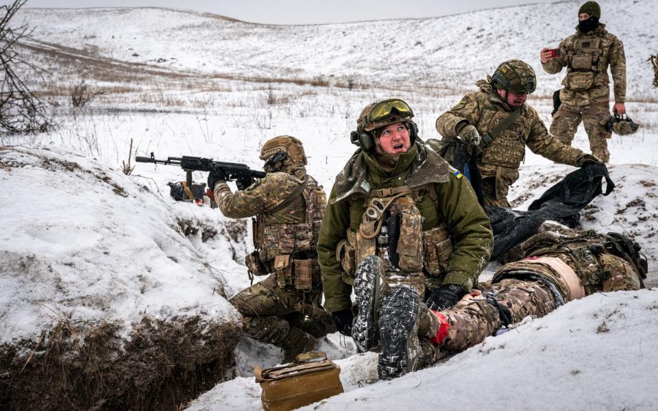 Ukrainian soldiers take part in a medical training exercise in Donetsk